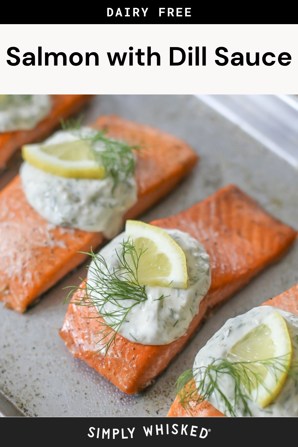 Baked salmon fillets topped with a dollop of creamy garlic dill sauce, a lemon wedge, and fresh dill, arranged on a baking sheet. Text reads Salmon with Creamy Garlic Dill Sauce and Simply Whisked.