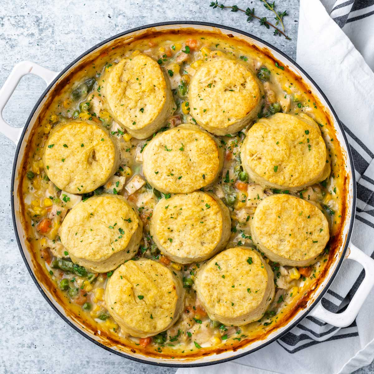overhead image of a skillet chicken pot pie with biscuit topping