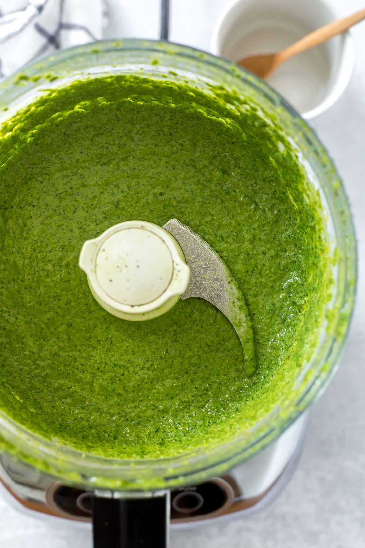 spinach basil pesto recipe blended in a food processor 