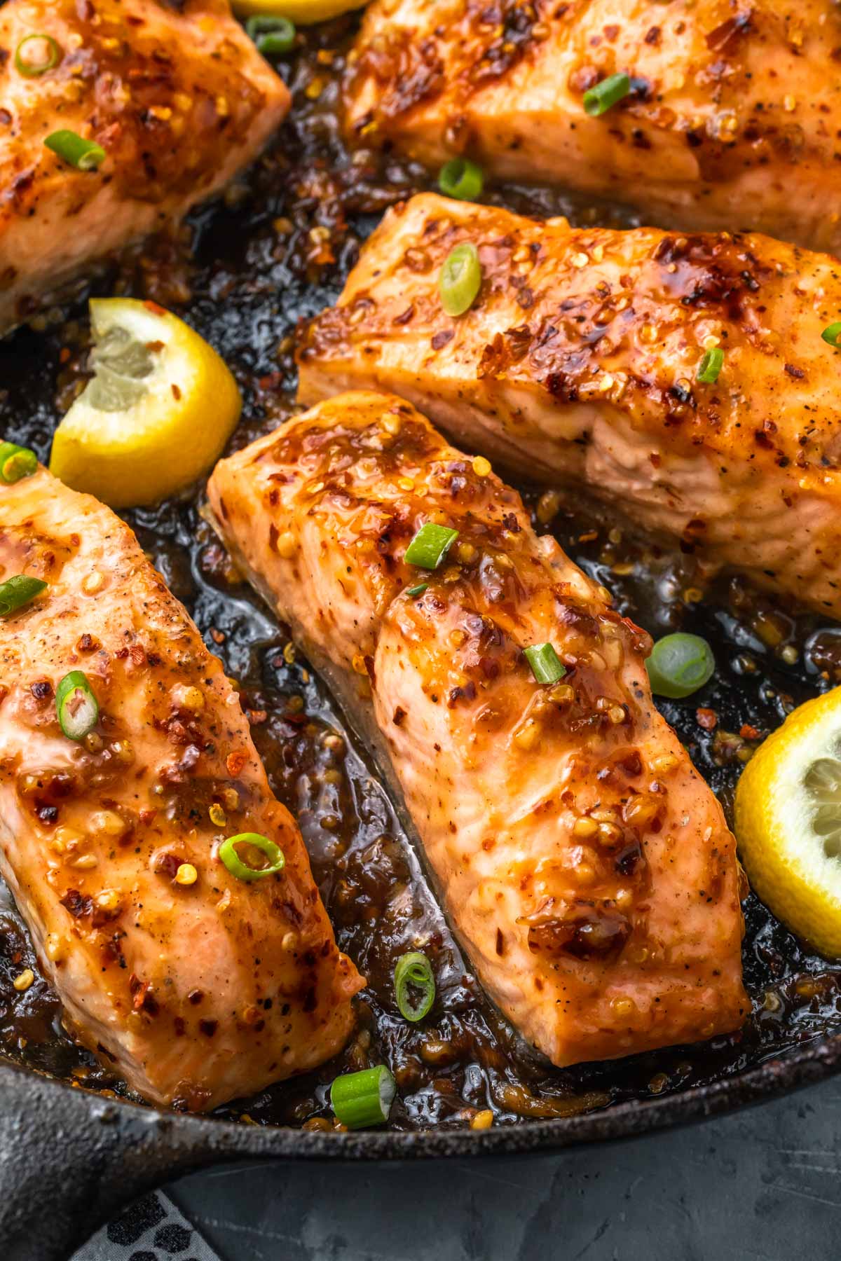 close up of sweet chili salmon baking in a skillet