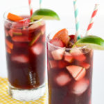 non alcoholic sangria in tall glasses with striped paper straws