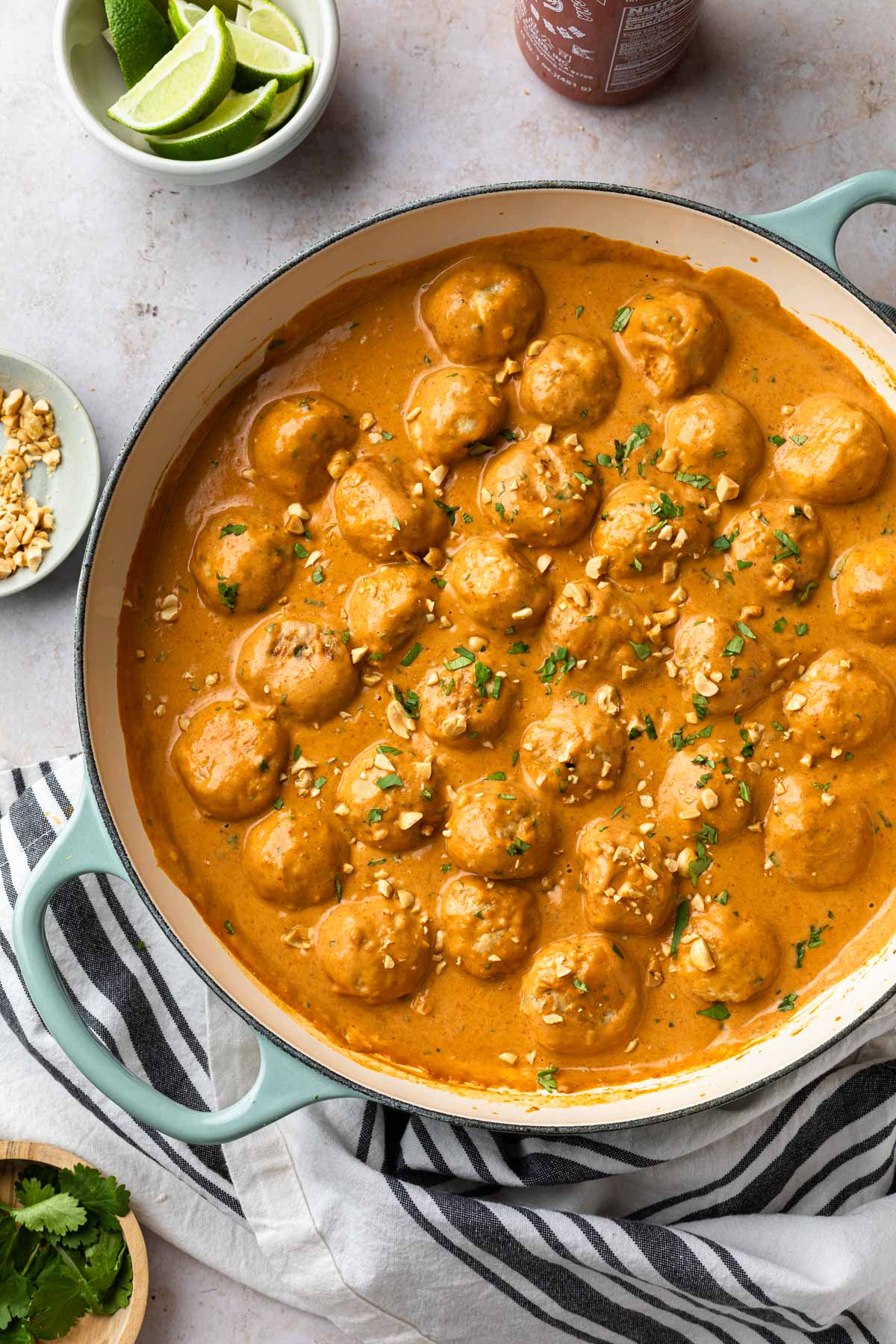 A skillet full of thai chicken meatball curry. 