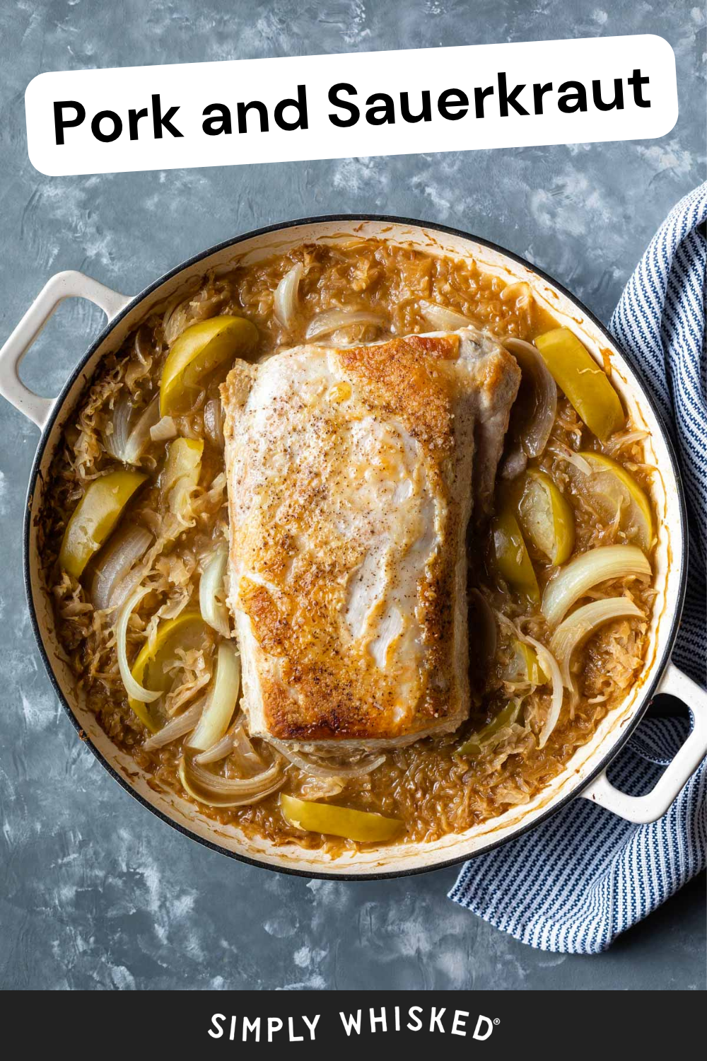 A pan of pork roast sits atop sauerkraut, sliced onions, and green apple wedges, perfectly capturing a classic pork and sauerkraut dish, with a blue-striped towel beside it. The image features text reading Pork and Sauerkraut and Simply Whisked.