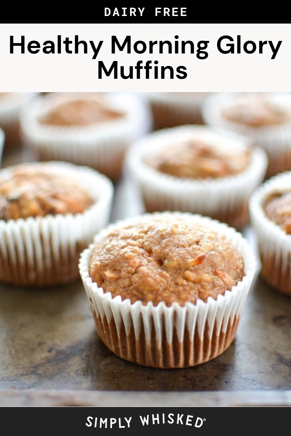 Close-up of several healthy morning glory muffins in white paper liners on a baking tray. Text above reads Healthy Morning Glory Muffins – Dairy Free. Text below says Simply Whisked.