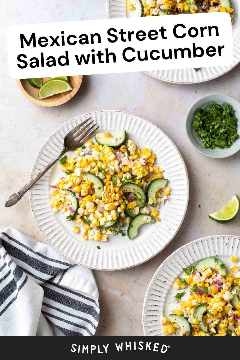 A plate of vibrant Mexican street corn salad with cucumber, red onion, and fresh herbs is surrounded by lime wedges, cilantro, and a striped napkin. Text on the image reads: Mexican Street Corn Salad with Cucumber.