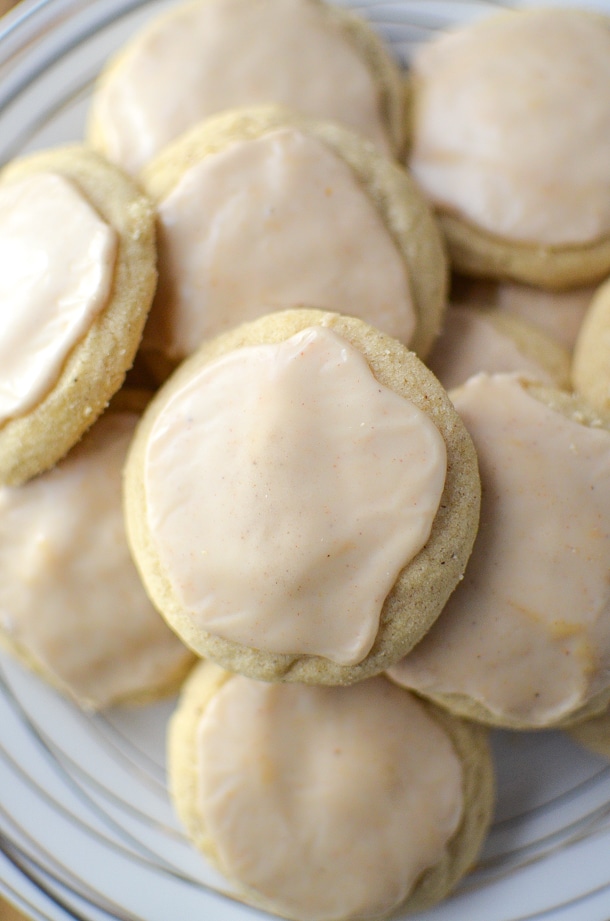 Cinnamon sugar cookies with maple frosting on a serving plate. 