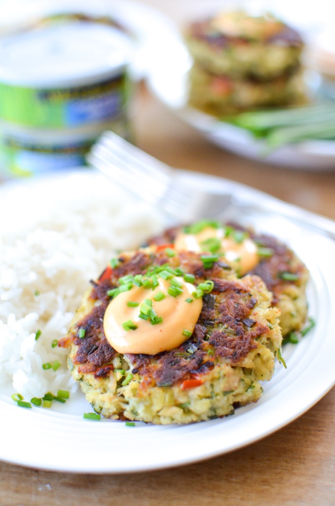Thai Tuna Cakes with Sriracha Aioli served on a plate with white rice. 