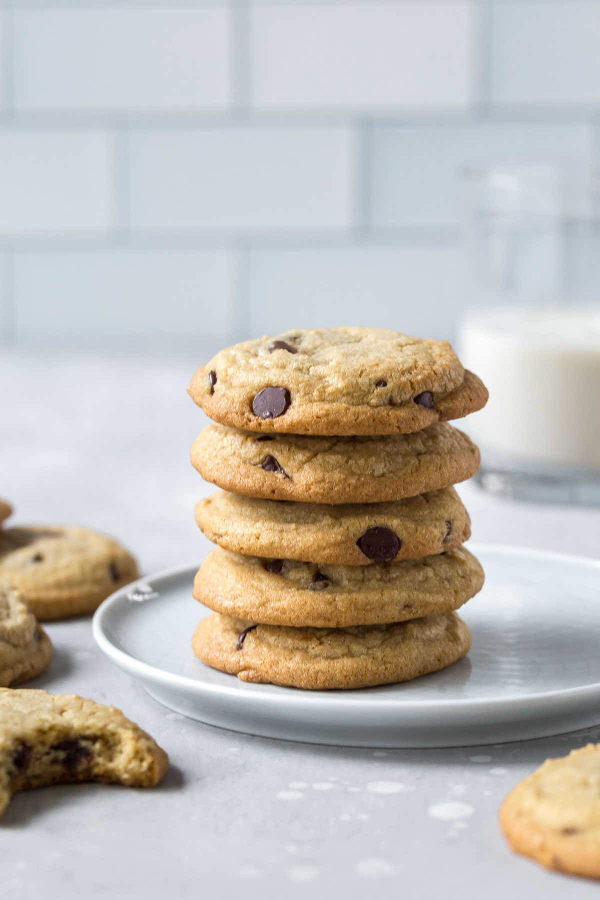 stack of dairy free chocolate chip cookies on a small gray plate