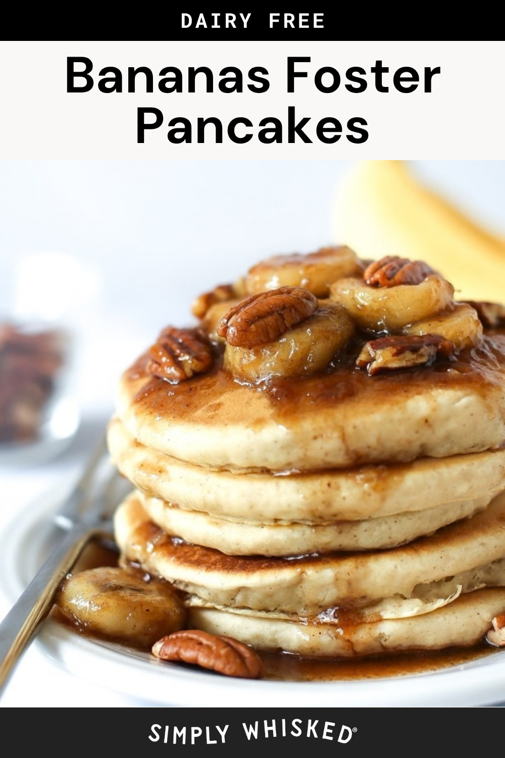 A stack of bananas foster pancakes topped with caramelized bananas, pecans, and syrup, on a white plate. The text above reads Dairy Free Bananas Foster Pancakes.
