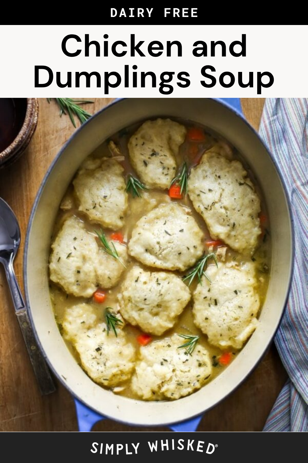 An oval pot of chicken and dumplings soup with fluffy dumplings, carrots, and herbs—featuring a hint of apple rosemary chicken flavor—sits beside a striped towel and a spoon. Text reads Dairy Free Chicken and Dumplings Soup and Simply Whisked.
