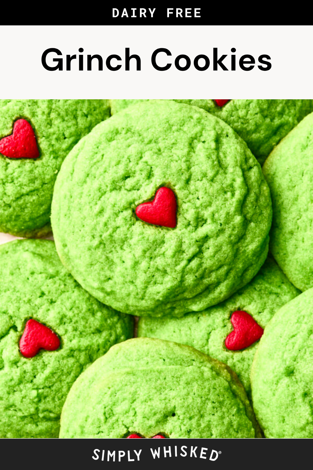 Green cookies with a small red heart in the center are stacked together. The top and bottom text read Dairy Free Grinch Cookies and Simply Whisked, making these grinch cookies a delicious dairy free treat perfect for any festive occasion.