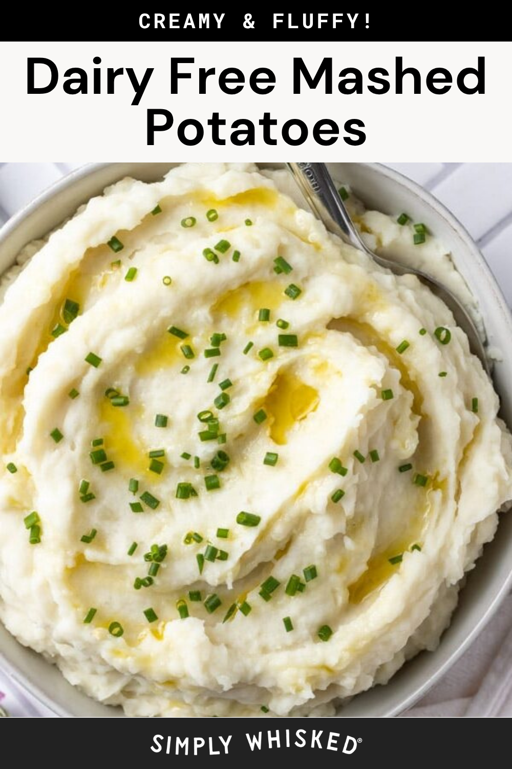 A bowl of creamy vegan mashed potatoes topped with chopped chives and drizzled with melted dairy-free butter, with a spoon resting in the bowl. Text reads Dairy Free Mashed Potatoes.