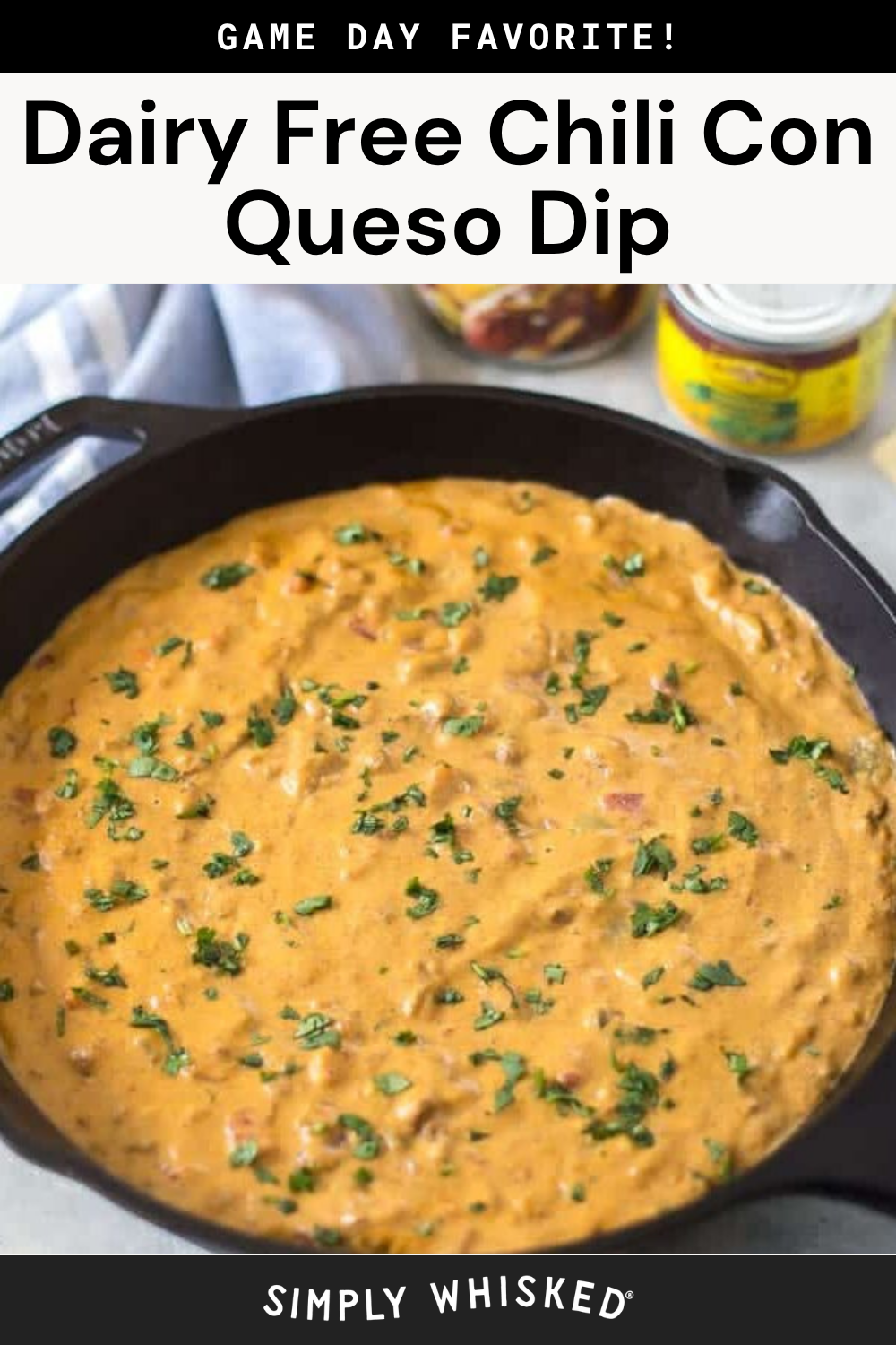 A skillet filled with creamy dairy-free chili con queso dip, garnished with chopped herbs. The text above reads, Game day favorite! This delicious chili con queso is the perfect dairy-free dip for your next gathering.