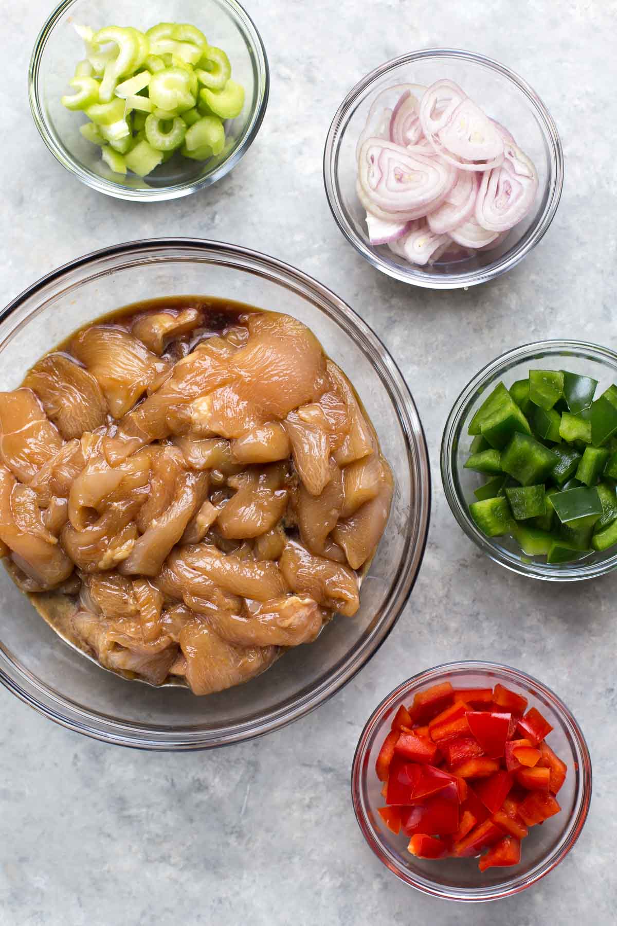 mise en place with marinating chicken for kung pao chicken recipe