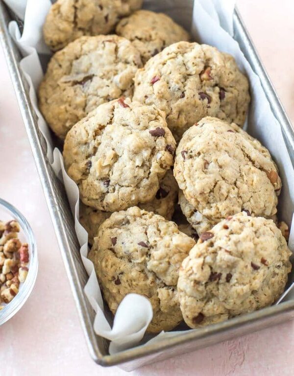 a vintage loaf pan holding a batch of vegan cowgirl cookies