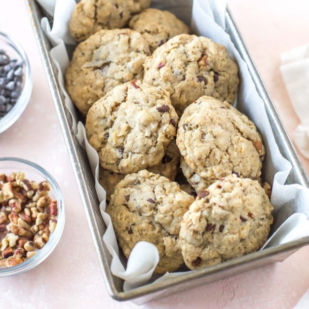 a vintage loaf pan holding a batch of vegan cowgirl cookies