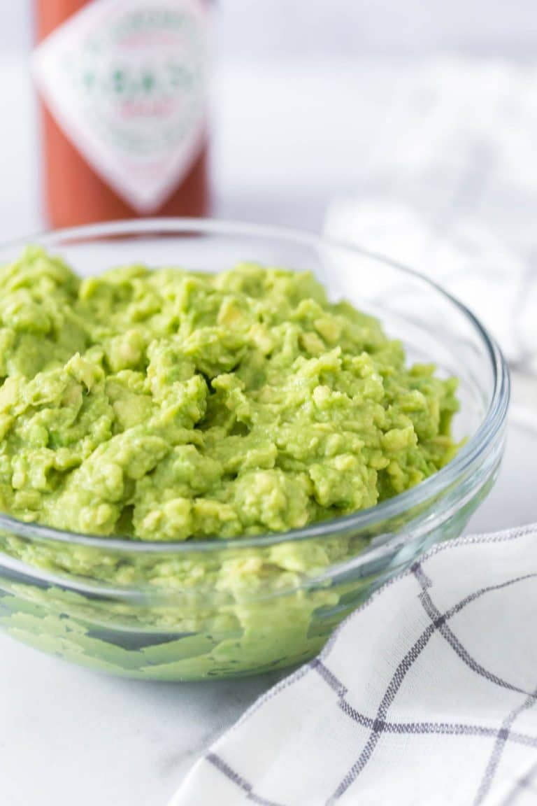 a bowl of mashed avocados