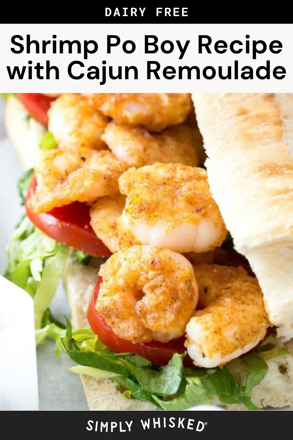 Close-up of a shrimp po boy sandwich with Cajun-seasoned shrimp, lettuce, and tomato on a baguette. Text above reads Shrimp Po Boy Recipe with Cajun Remoulade and Dairy Free—perfect for anyone craving an authentic shrimp po boy with classic Cajun remoulade flavor.