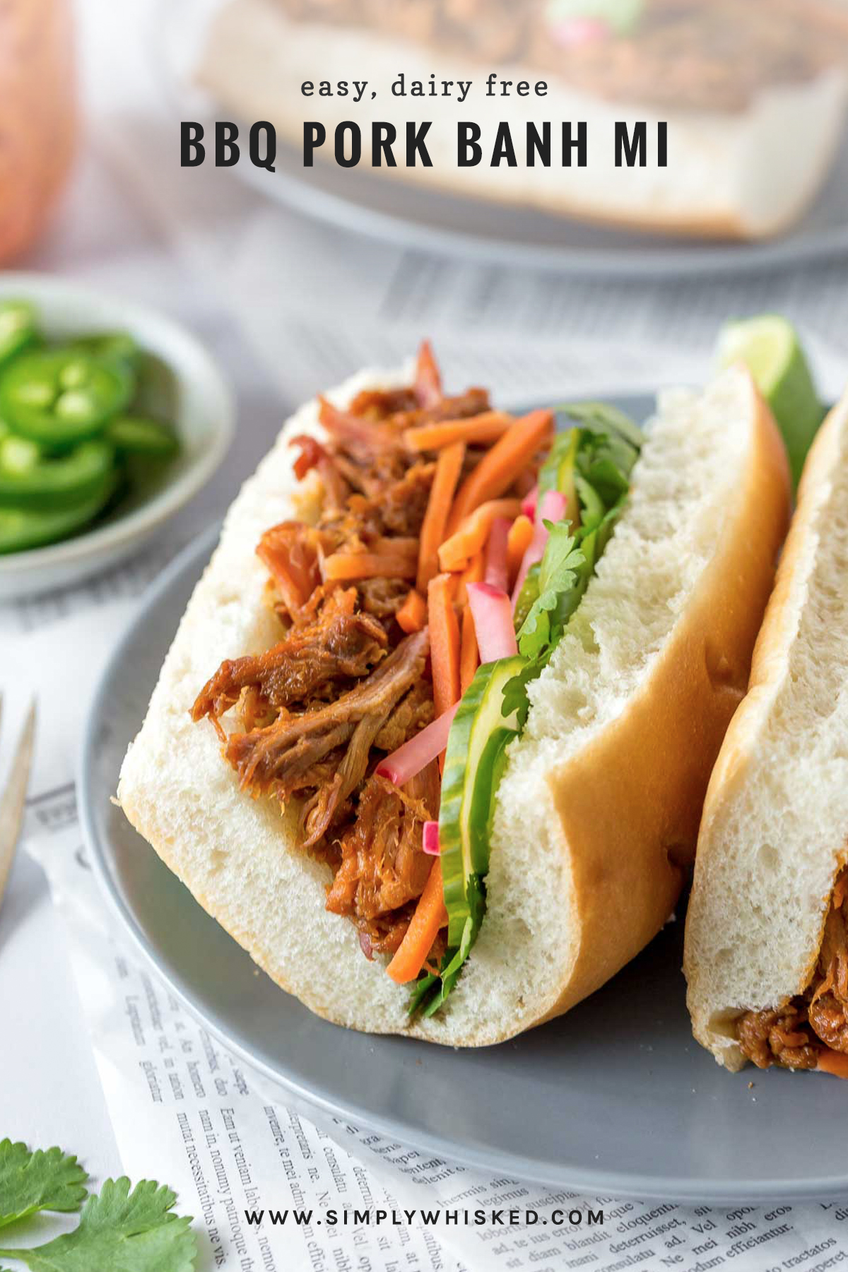 bbq pulled pork banh mi sandwich with pilled carrots and radishes