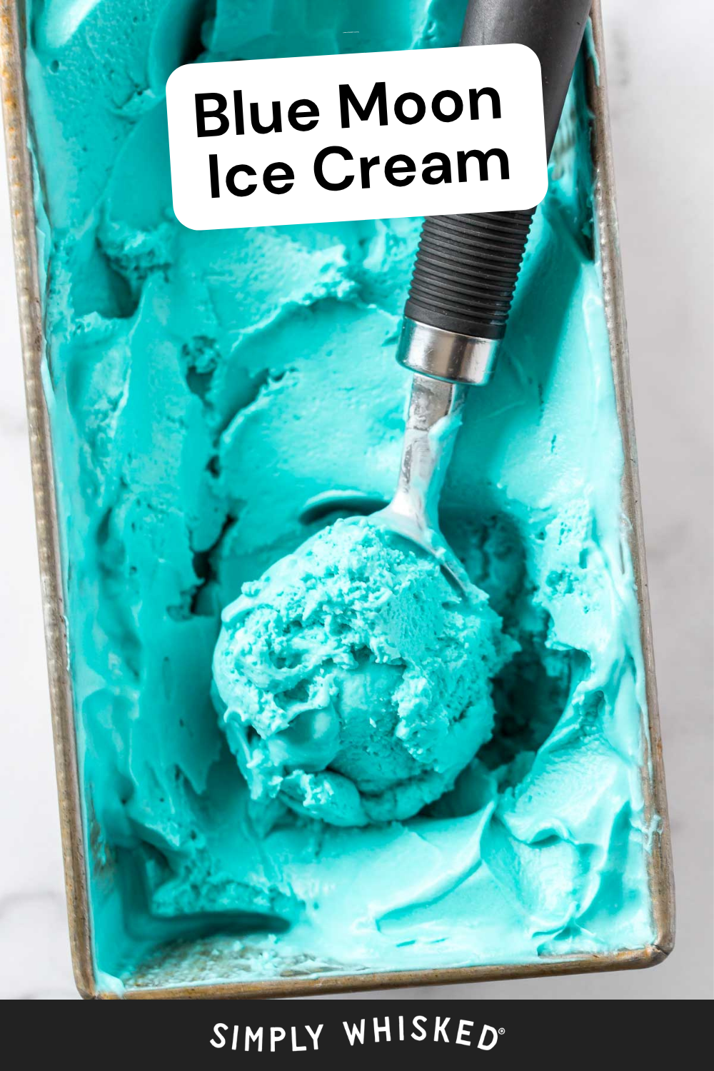 A metal tray filled with vibrant blue moon ice cream labeled Blue Moon Ice Cream, with an ice cream scoop resting inside. The brand Simply Whisked appears at the bottom.