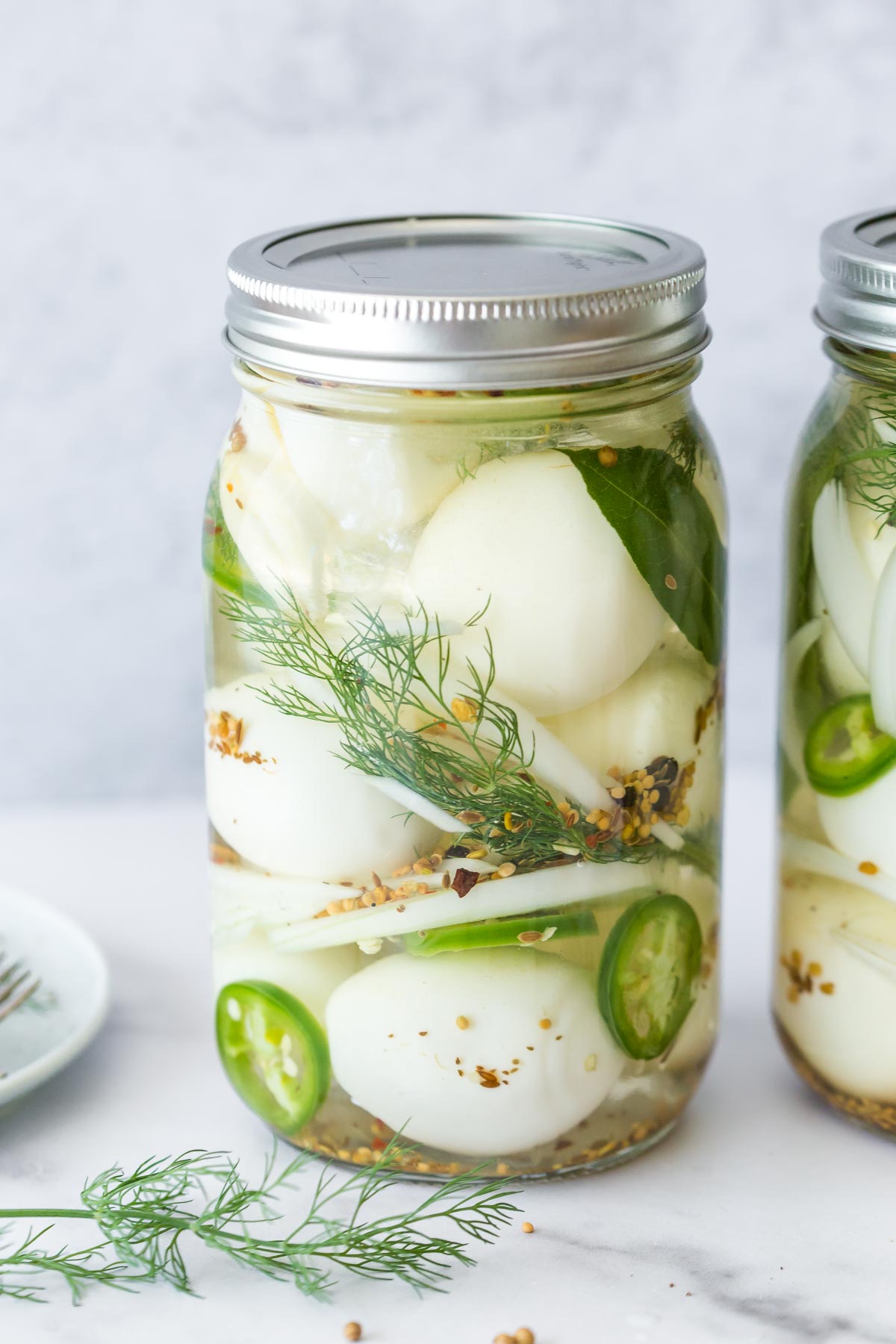 spicy pickled eggs recipe in a large mason jar