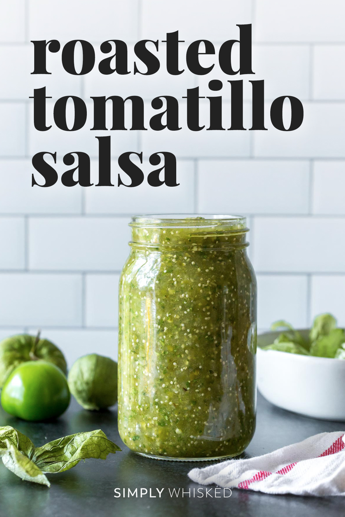 roasted tomatillo salsa recipe in a mason jar with a tile background - optimized for Pinterest with text overlay