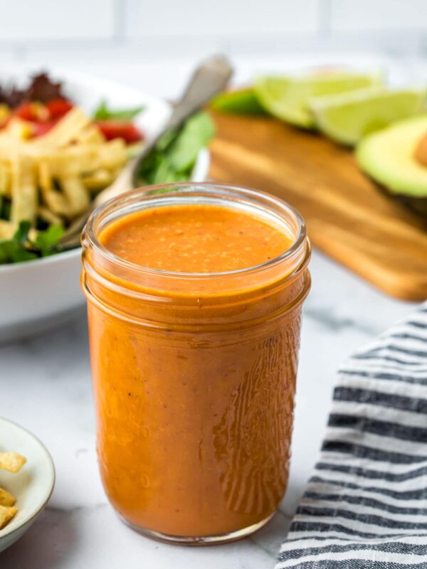 a small mason jar filled with Chipotle salad dressing
