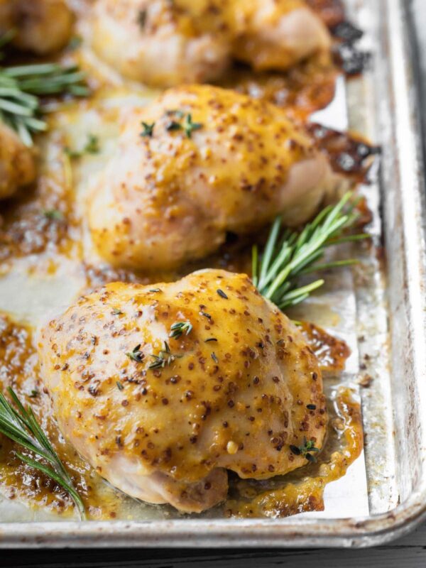 close up view of honey mustard glazed chicken thigh after baked