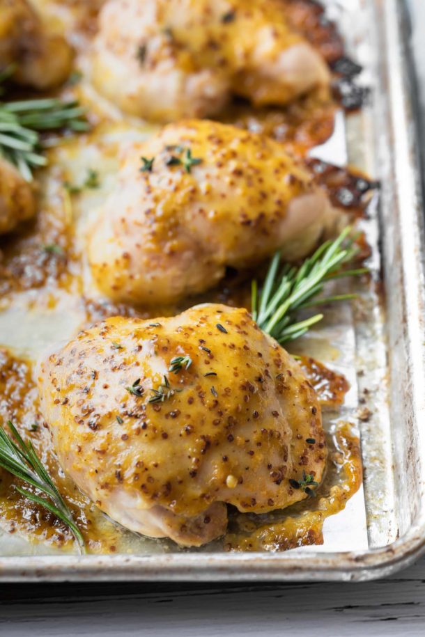 close up view of honey mustard glazed chicken thigh after baked