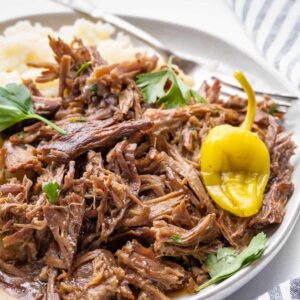 a close up view of shredded roast on a plate