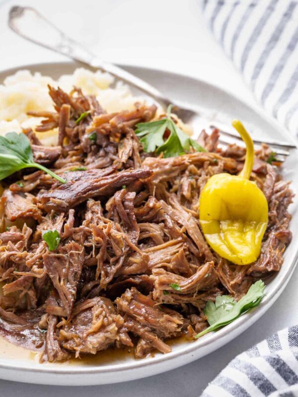 a close up view of shredded roast on a plate