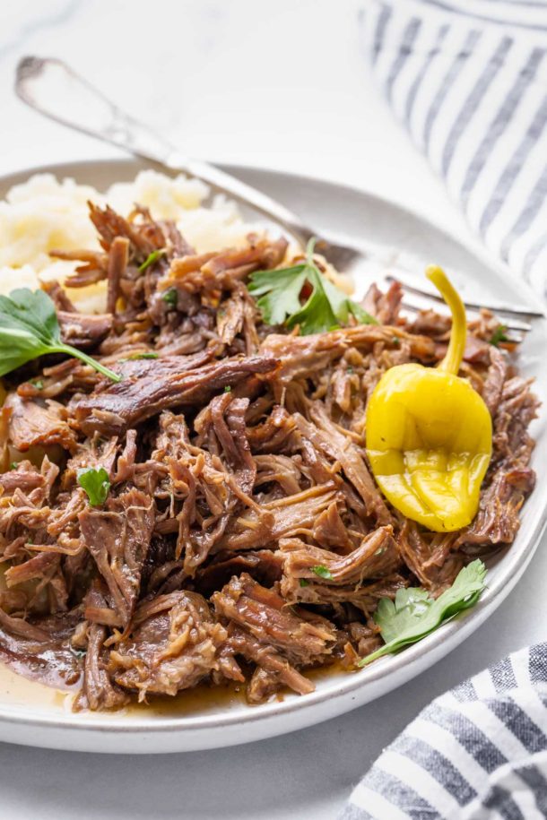 a close up view of shredded roast on a plate