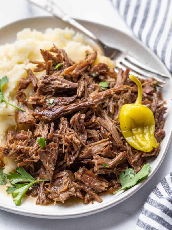 a close up view of shredded roast on a plate