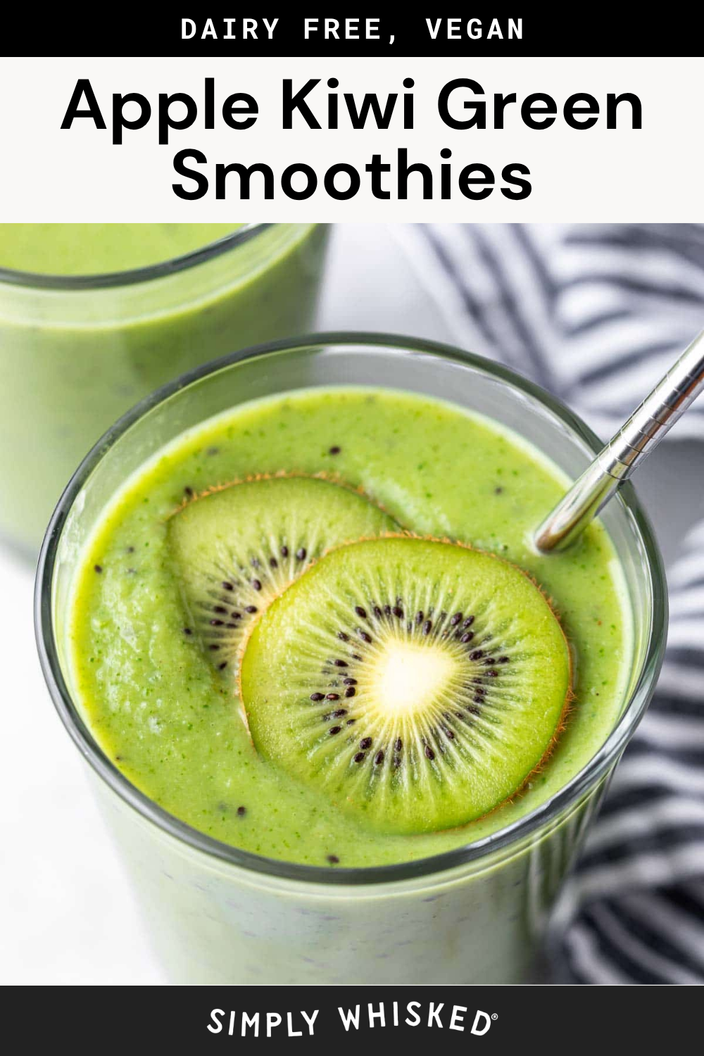 A glass of bright apple kiwi green smoothie, topped with two fresh kiwi slices and a metal straw, sits next to another glass and a striped cloth. The text above reads, Apple Kiwi Green Smoothies, Dairy Free, Vegan.