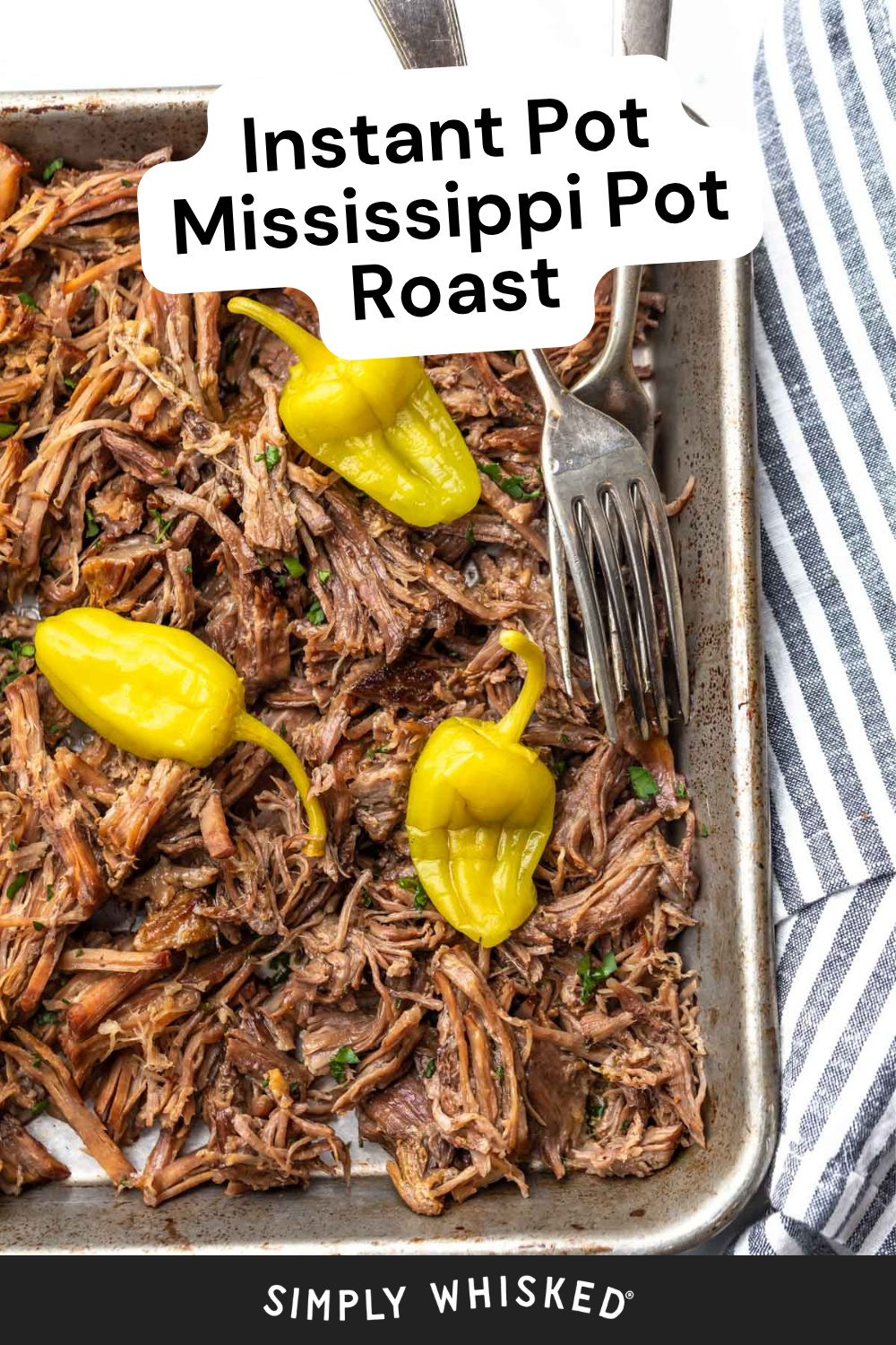 Shredded Mississippi pot roast topped with whole pepperoncini peppers in a baking tray, with a fork and striped kitchen towel on the side. Text overlay reads Instant Pot Mississippi Pot Roast.