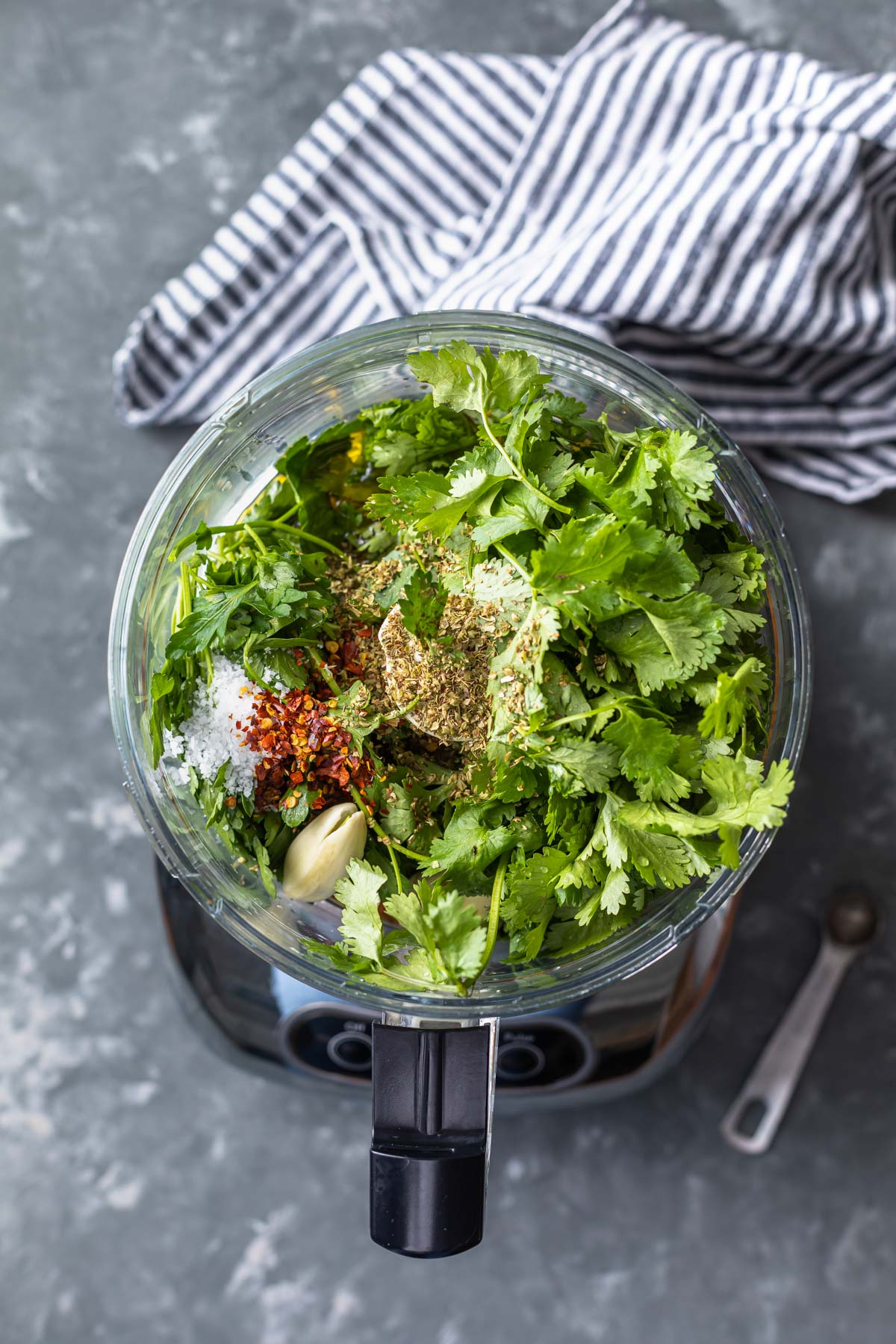 all of the ingredients for the chimichurri sauce in a food processor