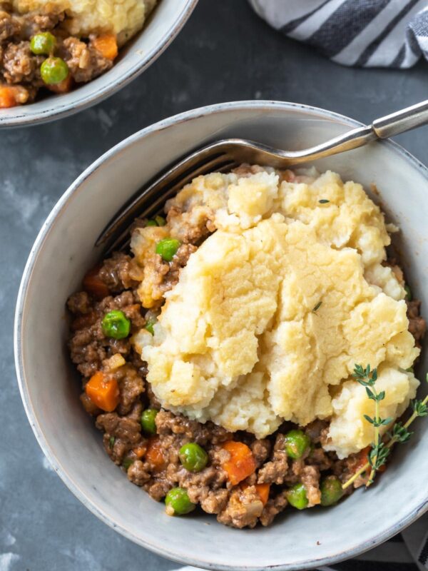 a serving bowl of shepherds pie with a fork