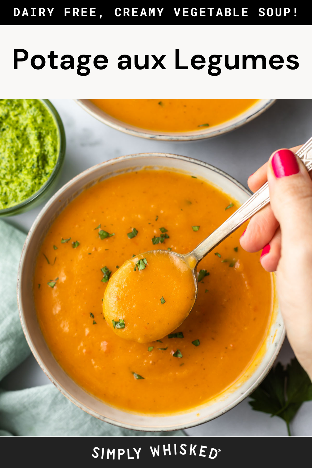 A hand holding a spoonful of creamy orange vegetable soup garnished with herbs, with a bowl of green sauce nearby. The text reads: Dairy free, creamy vegetable soup! Potage aux Legumes. Simply Whisked. Enjoy the comfort of homemade vegetable soup, beautifully presented and full of fresh flavor.