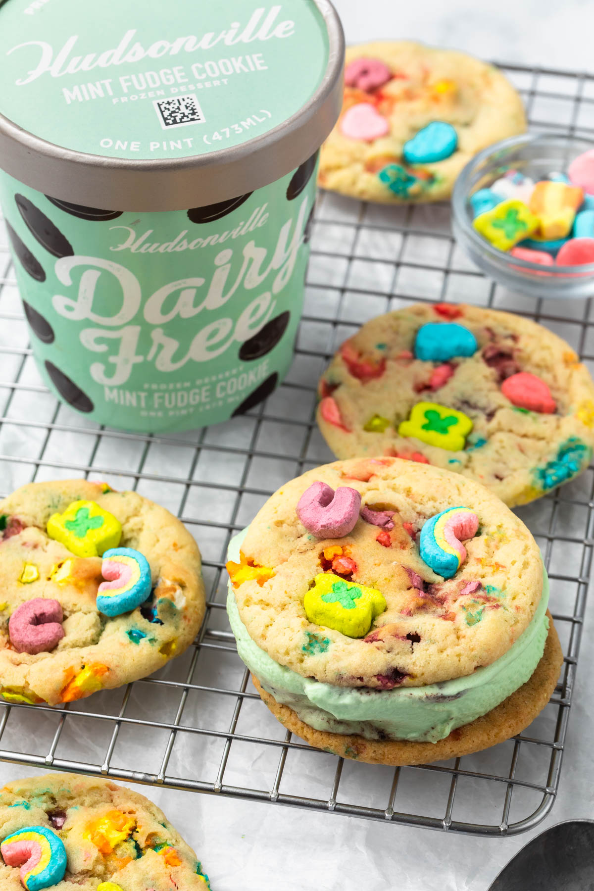 lucky charms cookie ice cream sandwiches on a cooling rack