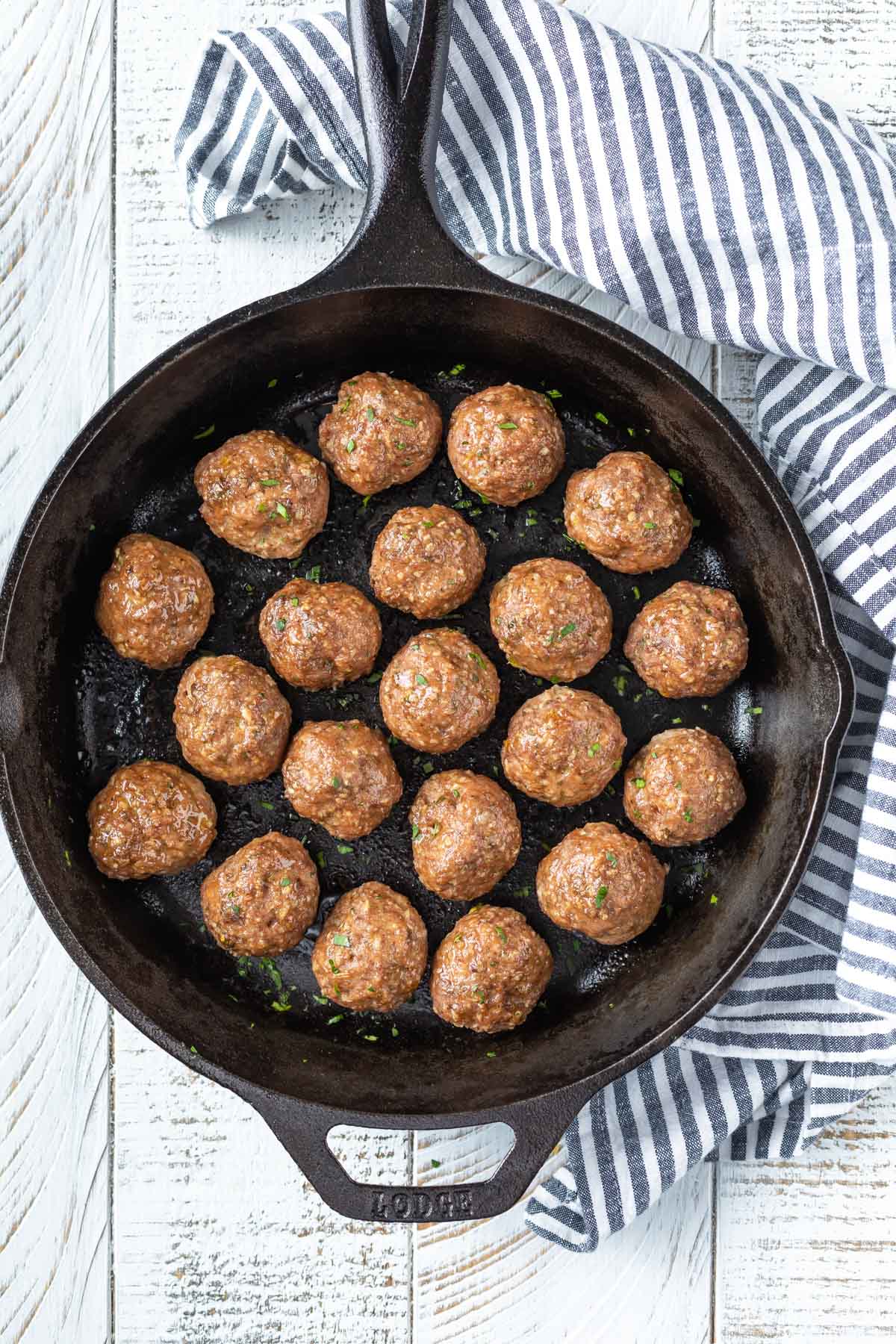 overhead image of meatballs in a cast iron skillet