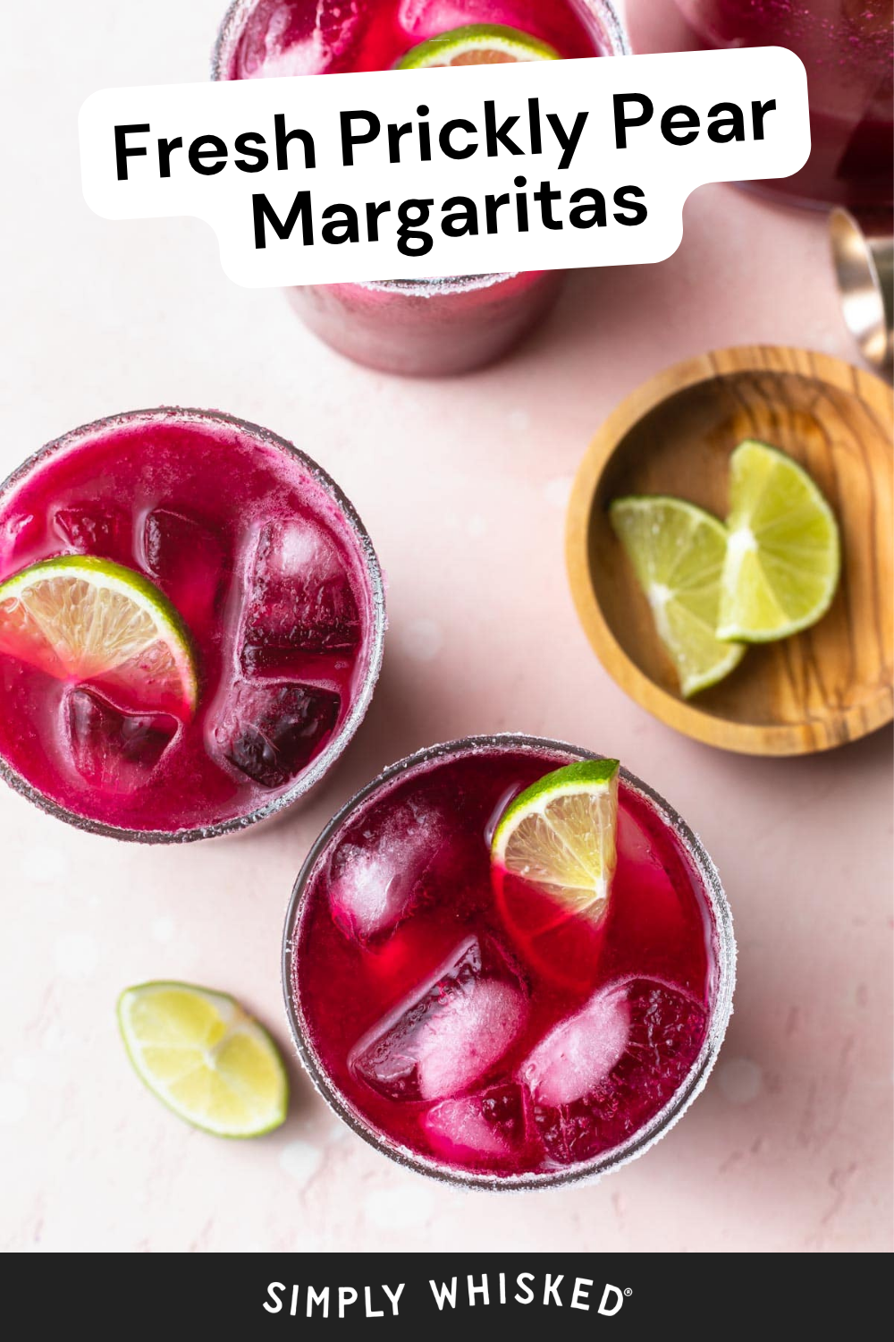 Overhead view of three vibrant pink prickly pear margaritas with ice and lime wedges, next to a small wooden bowl with more lime slices. Text reads “Fresh Prickly Pear Margaritas,” highlighting the irresistible appeal of these colorful prickly pear margaritas.