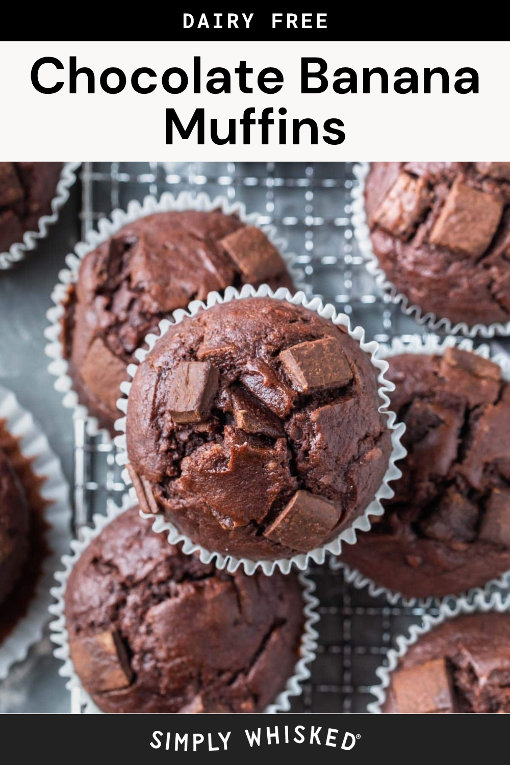 Close-up of several chocolate banana muffins with chocolate chunks on top, arranged on a cooling rack with white paper liners. The text above reads Dairy Free Chocolate Banana Muffins..