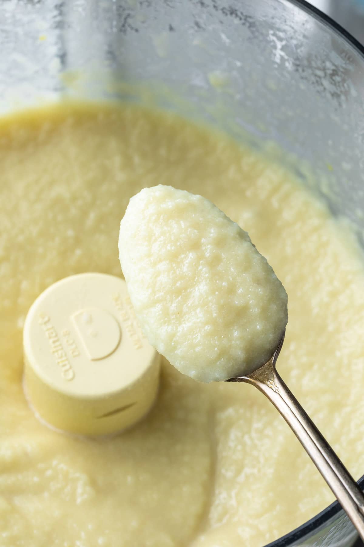 closeup of cauliflower alfredo sauce on a spoon