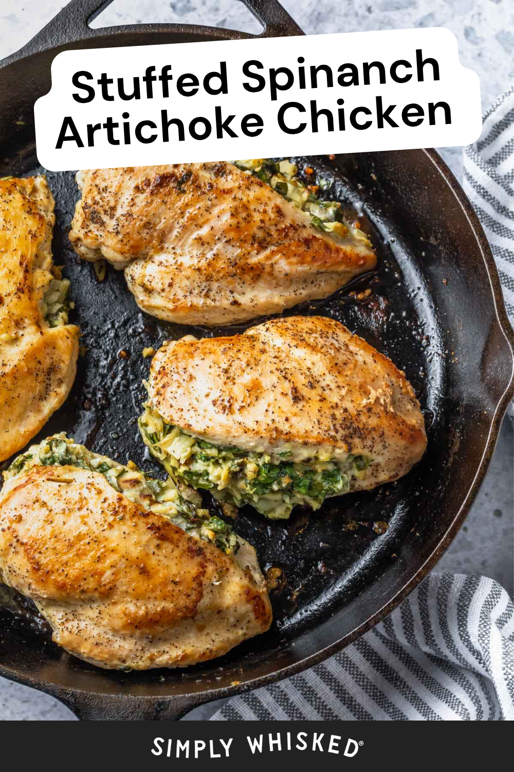 A cast iron skillet with golden-brown chicken breasts stuffed with a creamy spinach and artichoke filling, making the perfect skinny spinach artichoke chicken skillet. A striped kitchen towel is nearby. The text reads Stuffed Spinach Artichoke Chicken.