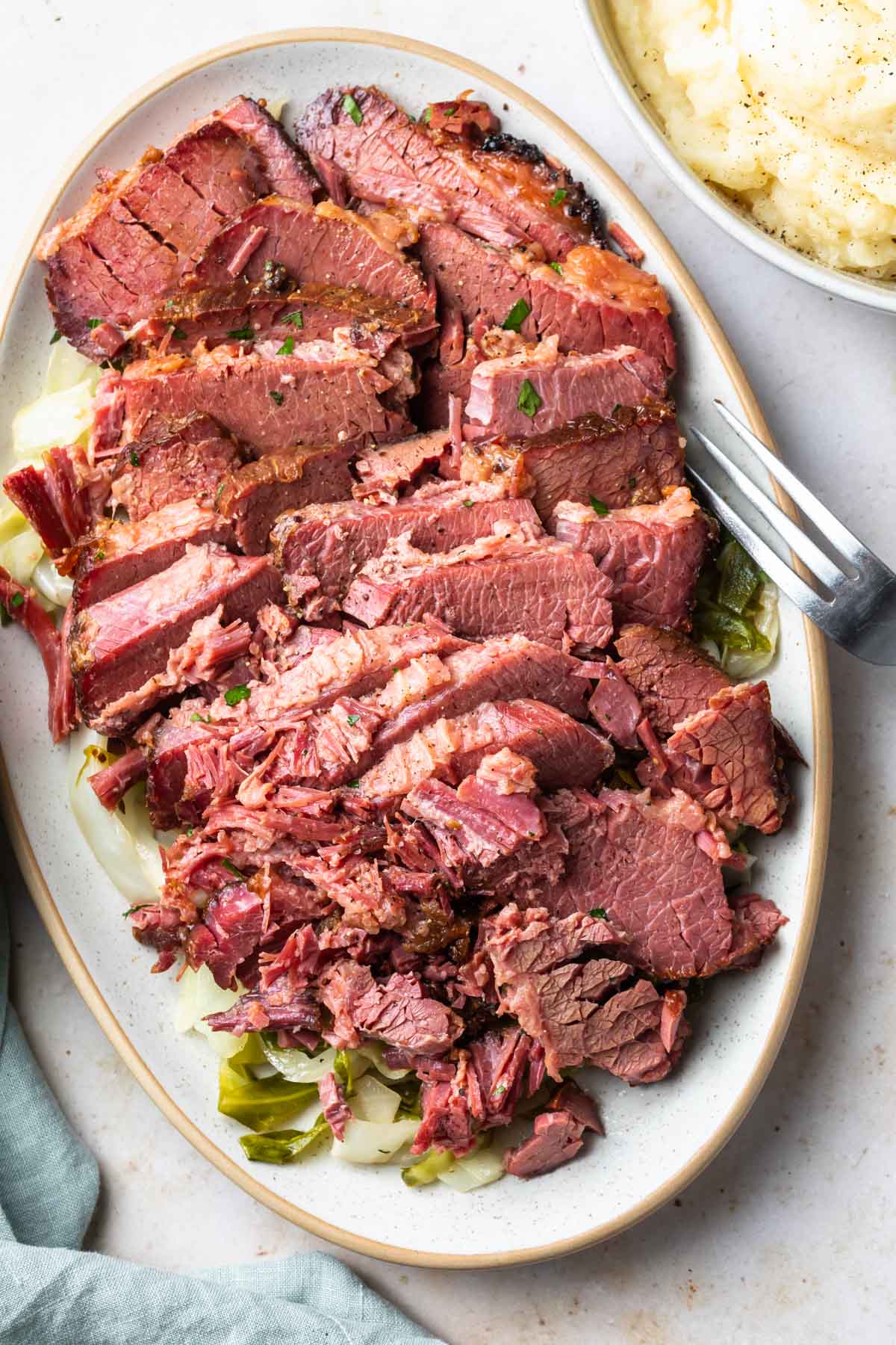 baked corned beef and cabbage on a platter
