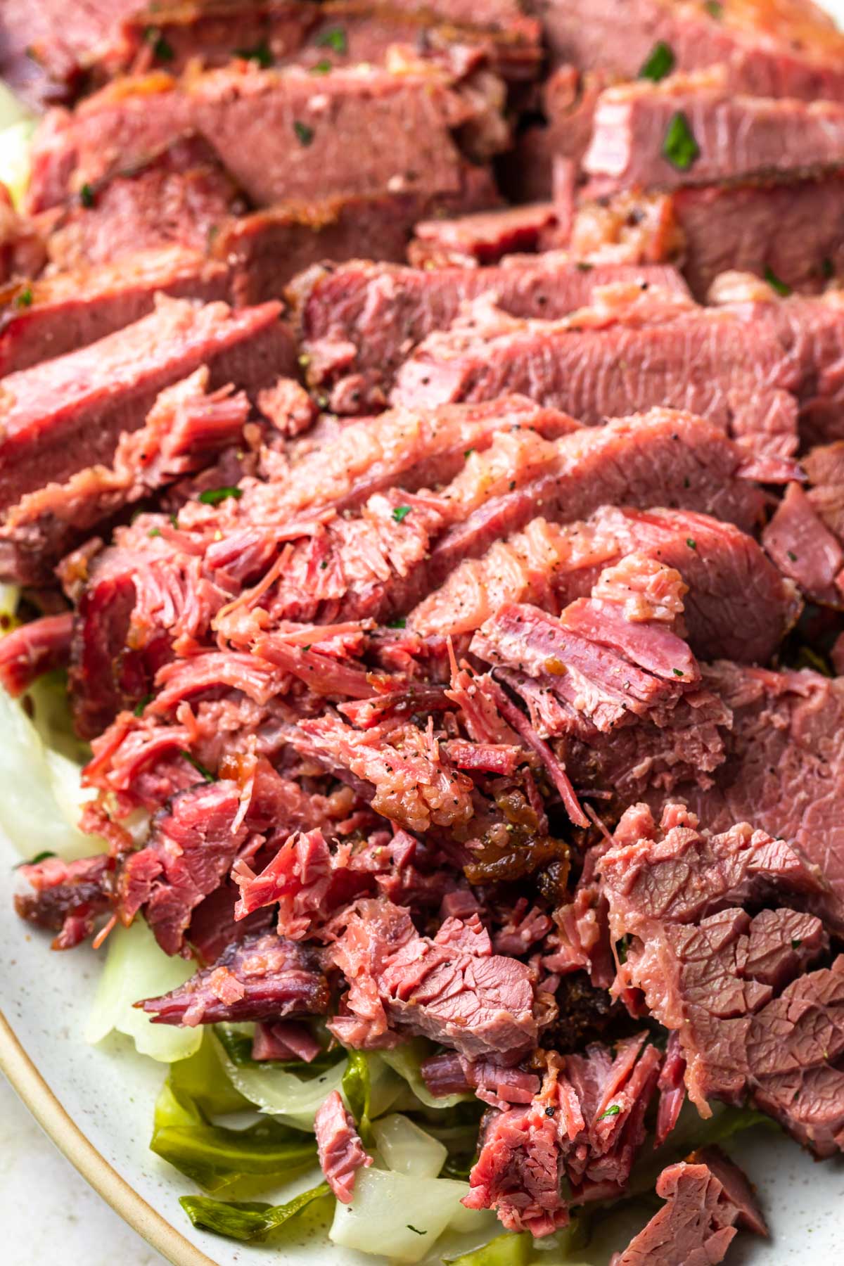 sliced and shredded corned beef on a platter