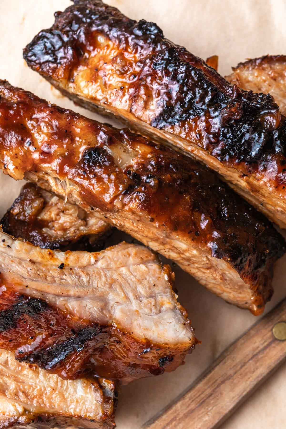 closeup of grilled dr pepper pork ribs with bbq sauce