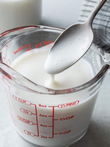 vegan buttermilk in a glass measuring cup