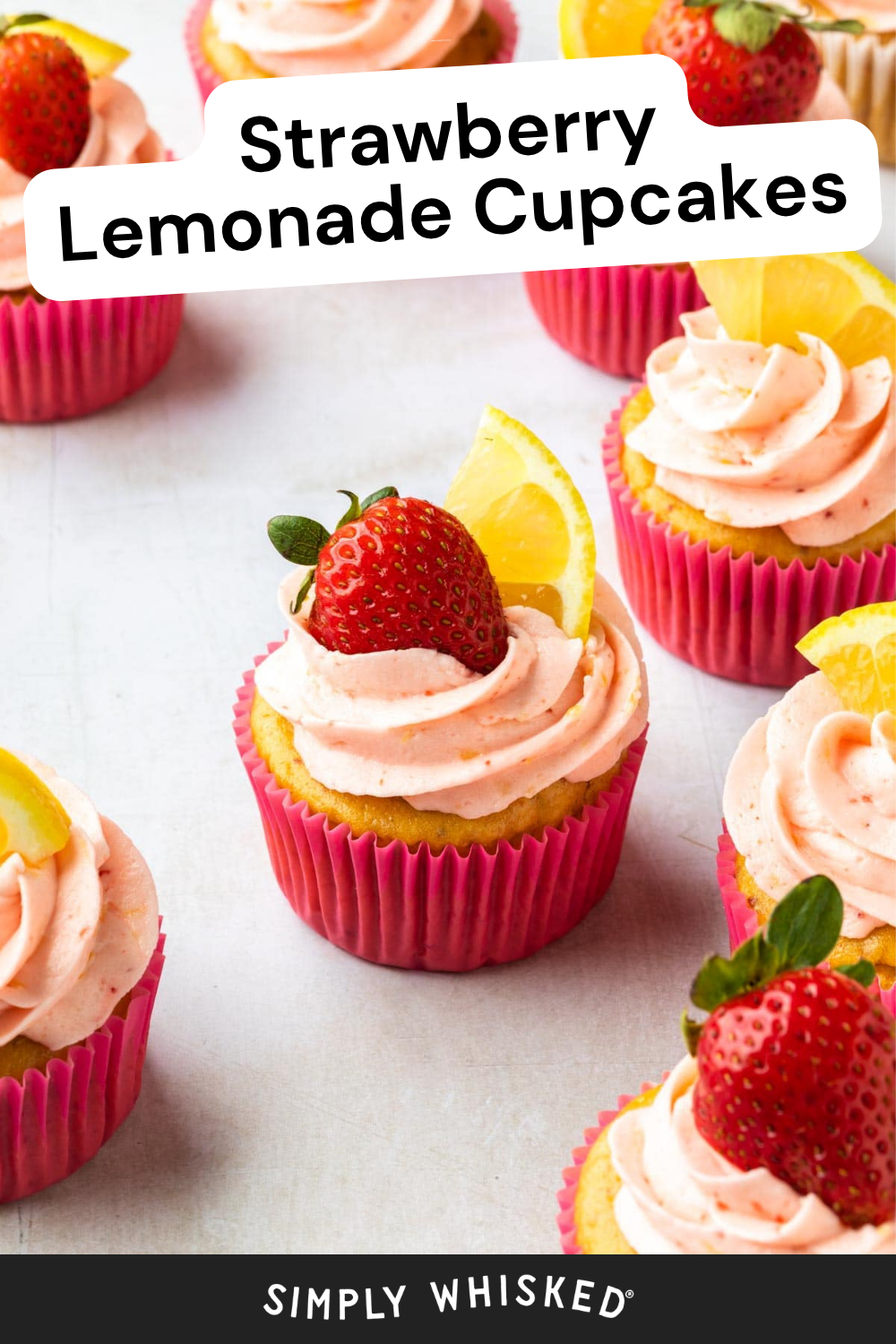 Cupcakes with pink frosting in pink wrappers, each topped with a fresh strawberry and lemon wedge. The text reads “Strawberry Lemonade Cupcakes” and “Simply Whisked,” highlighting these vibrant strawberry lemonade cupcakes in a bright and appealing dessert display.