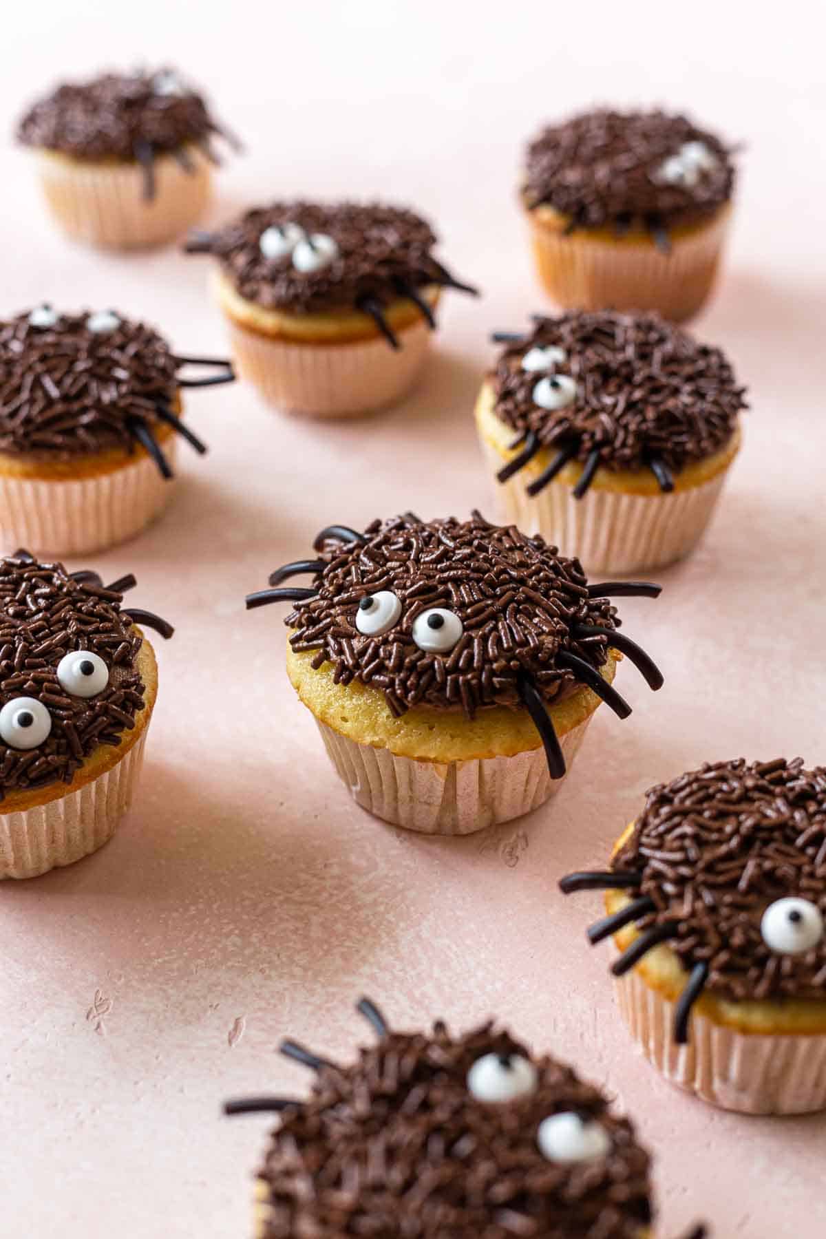 spider cupcakes on a pink background